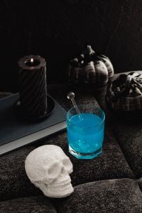 Kaboompics - Blue Halloween Drink With Skull Decoration