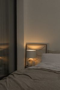 Kaboompics - Warm Bedside Lamp and Cozy Gray Bedding