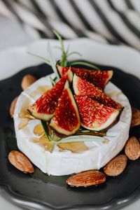 Kaboompics - Camembert with Fig and Rosemary on Black Plate, Copy Space Right