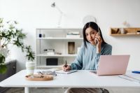 Kaboompics - Thoughtful Asian Woman Resting Her Head in a Minimalist Interior