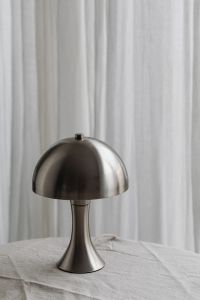 Kaboompics - Chrome Dome Desk Lamp on White Tablecloth