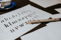 Kaboompics - Typography Practice Sheet with Pencil Letterforms and Calligraphy
