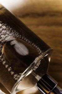 Kaboompics - Glass Bottle with Liquid Bubbles