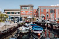 Kaboompics - Boats in a Naples Marina Channel Between Waterfront Buildings