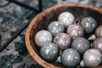 Kaboompics - Silver and Gray Christmas Baubles in a Rustic Wooden Bowl