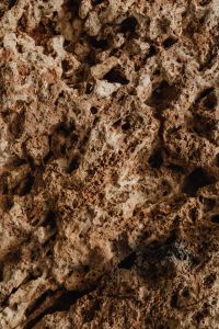 Kaboompics - Close Up of Brown Stone Pocked with Irregular Holes