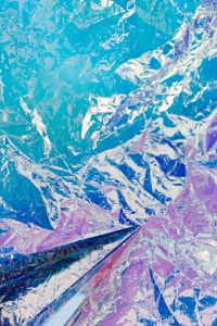 Kaboompics - Iridescent Blue Foil Texture with a Partial Prism for Abstract Wallpaper