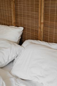 Kaboompics - Close-Up White Bedding and Bamboo Headboard