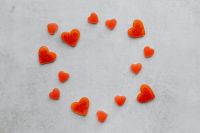 Kaboompics - Heart Candy Circle on Gray Background