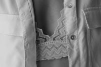 Kaboompics - White Shirt Layered Over Lace Bralette