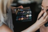 Kaboompics - A woman putting on make-up
