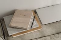 Kaboompics - Neutral Home Office Planner Setup with Laptop, Notebook, Pencil and Sofa