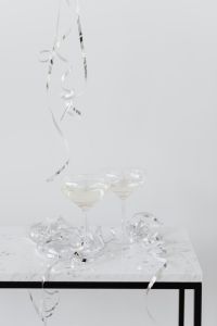 Kaboompics - Champagne Glasses Framed by Silver Party Streamers
