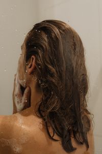Kaboompics - Woman Washing Her Face in the Shower