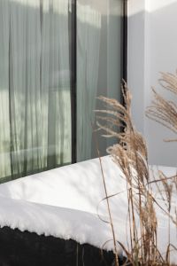 Kaboompics - Snowy Outdoor Bed Beside Winter Grasses