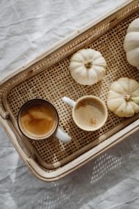Kaboompics - Top View of Coffee Cups and White Pumpkins in a Wicker Tray
