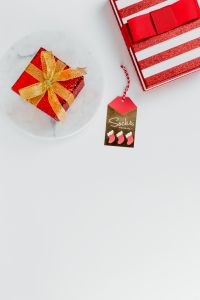 Kaboompics - Vertical Red Gift Boxes with Gold-Wrapped Present