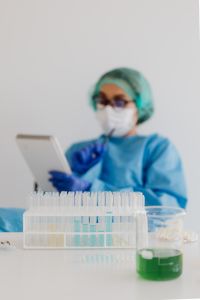 Kaboompics - Laboratory Researcher at Desk With Notebook in Soft Focus