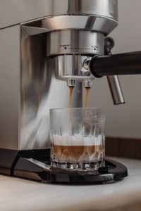 Kaboompics - Layered Coffee Pouring into a Faceted Glass