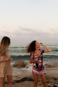 Kaboompics - Women Celebrating with Champagne on the Beach