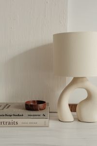 Kaboompics - Neutral Home Decor Still Life with Sculptural Lamp and Small Wooden Bowl