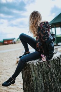Kaboompics - Side View of Woman Holding a Coca-Cola Can on the Beach