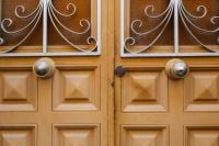 Kaboompics - Wooden Double Door with Iron Scrollwork