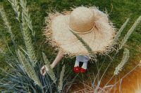 Kaboompics - Overhead Summer Scene with Straw Hat, Wheat and Red Shoes