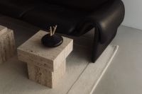 Kaboompics - Black Sofa with Wine Glasses on Travertine Table
