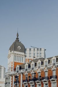 Kaboompics - Madrid Rooftop Spire Above Red Brick and White Stone Balconies