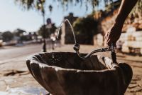 Kaboompics - Drinking fountain with stream of water on the sidewalk