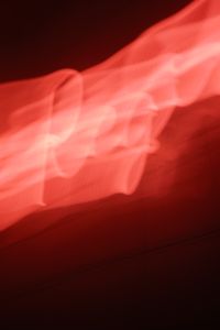Kaboompics - Abstract Red Neon Light Streaks Across Tiled Wall