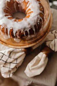 Kaboompics - Close Up of Iced Bundt Cake on Wooden Stand