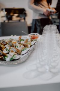 Kaboompics - Canape Platter and Rows of Glassware at a Dinner Reception