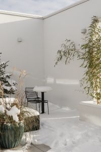 Kaboompics - Snowy White Patio with Bamboo and Outdoor Furniture