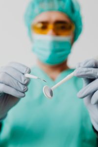 Kaboompics - Dentist Holding Mirror and Dental Probe