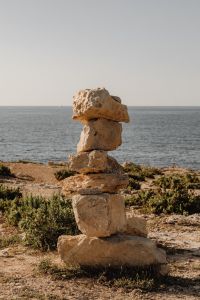 Kaboompics - Small Stone Cairn on a Rocky Seashore