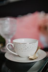 Kaboompics - Cup and gold tea spoon