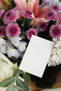Kaboompics - Angled Blank Card among Purple Chrysanthemums and Pastel Bouquet Flowers