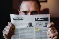 Kaboompics - Young man and newspaper