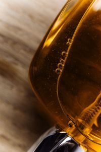 Kaboompics - Amber Liquid Bottle Macro Texture