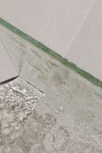Kaboompics - Abstract Glass Panels with Diagonal Green Seams and Textured Shadow