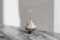 Kaboompics - Silver Bowl with Whipped Cream Dessert and Candle on Arabescato Marble