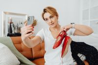 Kaboompics - Fashion Seller Taking a Selfie with Red Heels for Boutique Social Media
