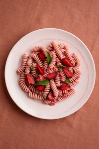 Kaboompics - Strawberries and Mint Garnishing Pink Fusilli