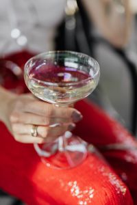 Kaboompics - Champagne in Hand with Red Sequin Suit and Silver Ribbon