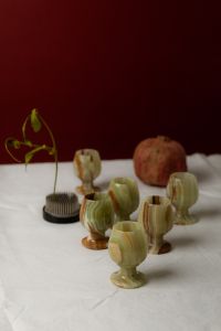 Kaboompics - Vintage Green Glassware and Pomegranate on Linen, Moody Still Life