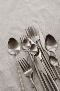 Kaboompics - Assorted Silver Cutlery Flat Lay with Spoons, Forks and Knives