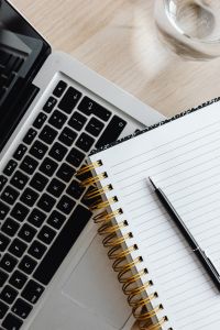 Kaboompics - Top View of Laptop Keyboard and Notebook with Pen