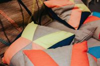 Kaboompics - Color-Block Decorative Pillows in Coral, Blue, Gray and Green, Contemporary Textile Design